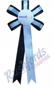 -Looped Disc with 20cm Long Tails-
Florettes
Florettes are basically a fancier form of the Button/Disc Rosette. made with lurex edge ribbon which are then looped giving it a shape similar to a flower.
Printing is done on the first tail with extra printing done on all other available tail at extra cost.
Number of tails can be 2 or 3, one tail being extra.